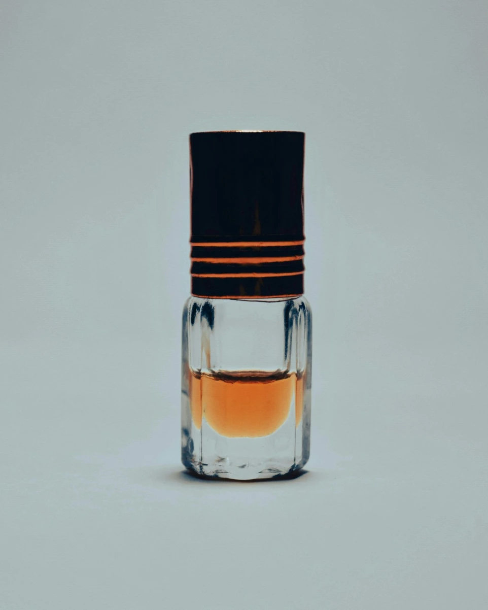 a glass bottle with a liquid inside of it